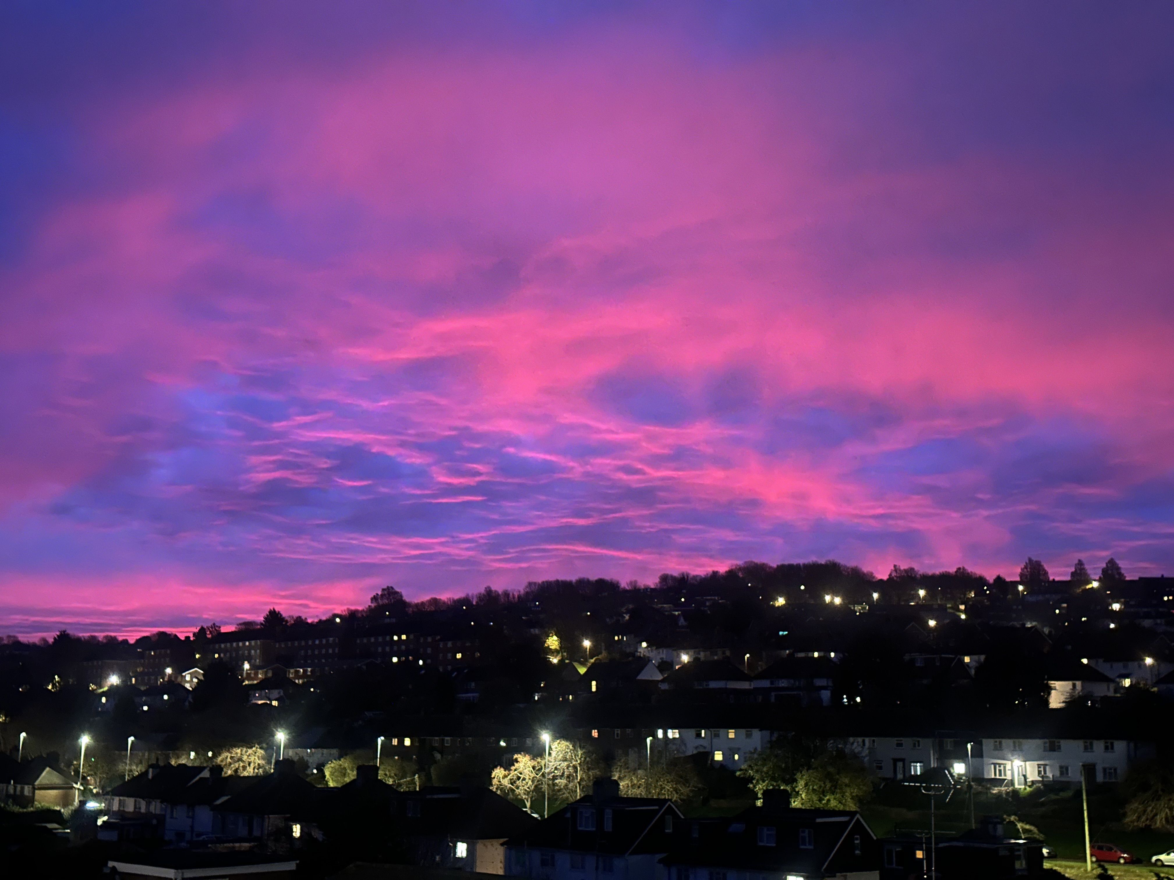 A photo of some really cool pink/purple clouds over Patcham