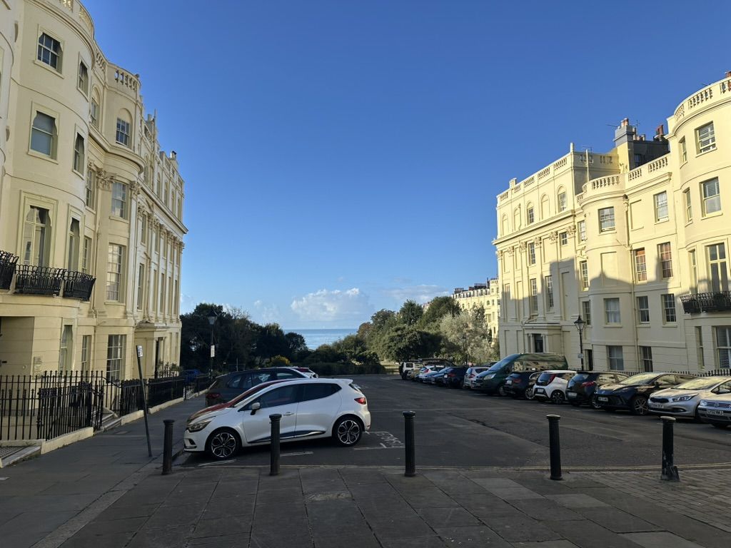 Photo of the sea viewed through some big Regency terraces